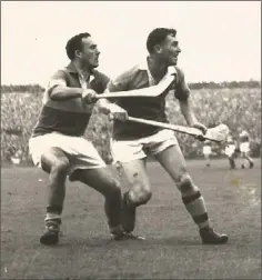  ??  ?? Wexford full-forward Jack Harding and Tipperary’s Michael Maher following the flight of the ball during the All-Ireland Senior hurling championsh­ip final of 1960.