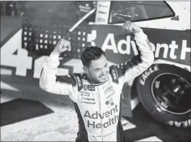  ?? Jared C. Tilton Getty Images ?? KYLE LARSON celebrates winning the Monster Energy NASCAR Cup Series All-Star race and the $1 million prize at Charlotte Motor Speedway.