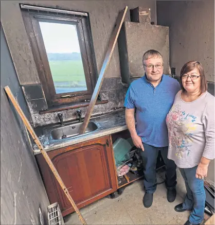  ??  ?? Tracy and Allan Fraser were only offered £3,000 after a fire detroyed their utility room and their home’s heating system was put out of action for four months