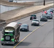  ?? ?? A convoy of trucks and other vehicles travel the I-495 Capital Beltway near the Woodrow Wilson Bridge to protest vaccine mandates and other issues earlier this month in Fort Washington, Md.