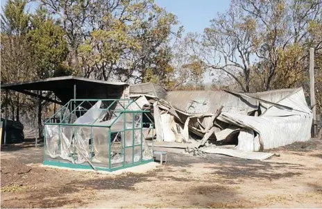  ?? Photo: Sandra McEwan Photograph­y ?? DESTROYED SHED: This shed on Caves Rd in Stanthorpe was destroyed in the recent bushfire. The house was saved. The shed held hundreds of dollars of artworks, bottles of wine, furniture and a caravan.