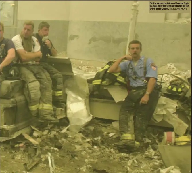  ?? (MARK LENNIHAN/AP) ?? First responders at Ground Zero on Sept. 11, 2001 after the terrorist attacks on the World Trade Center.