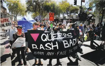  ?? Santiago Mejia / The Chronicle ?? Protesters march along Berkeley’s Telegraph Avenue to the UC campus on Sept. 23 in opposition to the far right’s Free Speech Week.