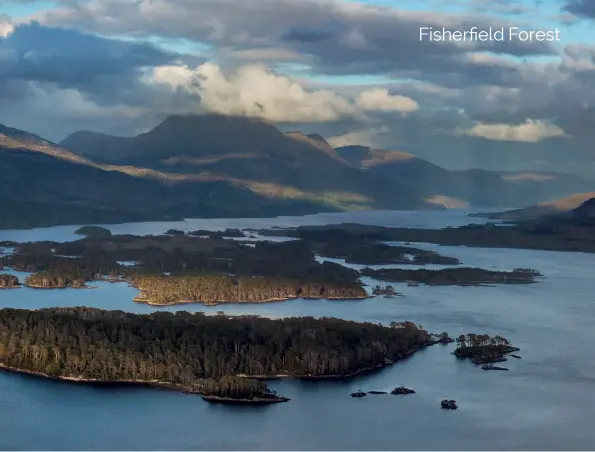  ??  ?? THE ISLANDS OF LOCH MAREE
Access to Creag Ruadh is a little awkward but it offers an excellent view for such a small hill. From the top the numerous islands on Loch Maree line up almost perfectly with the towering presence of Slioch at the back.