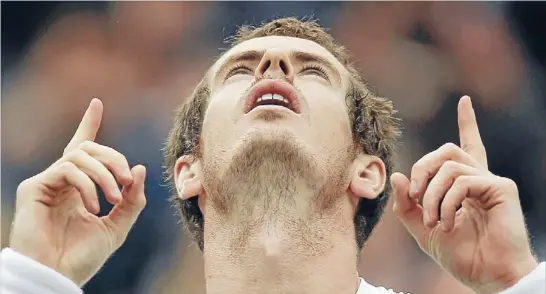  ?? Photo: GETTY IMAGES ?? Looking up: Andy Murray’s quarterfin­al victory over David Ferrer has the British crowd hoping for a end to a Wimbledon finals drought that has endured since 1938.