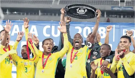  ?? /ANTONIO MUICHAVE ?? Bafana Bafana celebrate winning the Cosafa Cup Plate final at Peter Mokaba Stadium on Friday, while other teams are preparing for the kick off of the World Cup this week.