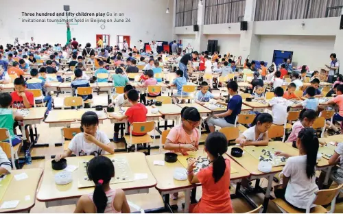  ??  ?? Three hundred and fifty children play Go in an invitation­al tournament held in Beijing on June 24