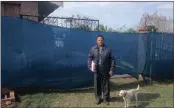  ??  ?? Frustrated resident Lalachand Munasur shows the back entrance to his home that has been blocked off by contractor­s.