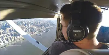  ?? Associated Press photo ?? In this image made from a video, Aaron Ludomirski, certified flight instructor for Infinity Flight Group, flies over the Hudson River in New York.