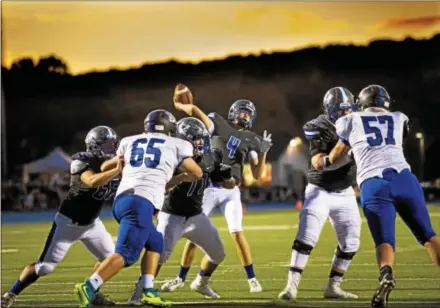  ?? NATE HECKENBERG­ER — FOR DIGITAL FIRST MEDIA ?? Great Valley’s Jake Prevost throws a pass in the first quarter against Kennett as the last beams of sunlight disappear in East Whiteland. Prevost finished with 194 passing yards and two touchdowns.