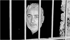  ?? — AFP file photo ?? Pakistani local pediatrici­an alleged to have been responsibl­e for the HIV outbreak, DrMuzaffar Ghangro, is seen behind the bars at a local police station.