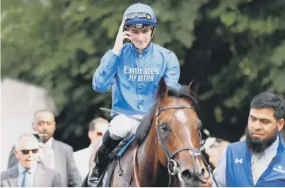  ?? ?? Jockey Hector Crouch celebrates with Dubai Tradition after winning the Maritime Cargo Handicap at Newmarket