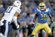  ?? AP/DANNY MOLOSHOK ?? Linebacker Myles Jack (right) might have to sit out this season because of a knee injury, but the former UCLA standout was still drafted by Jacksonvil­le in the second round with the 36th overall pick.