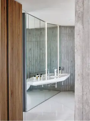  ??  ?? FROM TOP
A white faceted vanity in the en suite bathroom; off-shutter concrete dominates with taps from Ocean Range by Quadro, selected for their mechanical, space-age design