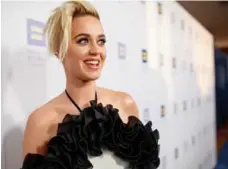  ?? CHRISTOPHE­R POLK/GETTY IMAGES ?? Many found Katy Perry’s 2008 hit “I Kissed a Girl” to be an anthem of low-stakes experiment­ation for straight women.