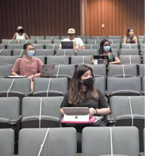  ?? JAY JANNER/USA TODAY NETWORK ?? Karina Patino, front, attends a criminolog­y class at the Gates Dell Complex at the University of Texas on Wednesday.
