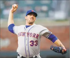  ?? John Bazemore / Associated Press ?? Mets starting pitcher Matt Harvey works against the Atlanta Braves in the first inning on Thursday in Atlanta. It was Harvey’s last start before moving to the bullpen.