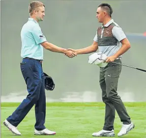  ?? Picture: Getty ?? SHAKE ON IT: Russell Knox with playing partner Rickie Fowler.