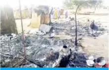  ??  ?? MAIDUGURI: Smoldering ashes are seen on the ground in Budu near Maiduguri after the latest attack this weekend by Boko Haram fighters on a funeral in northeast Nigeria has left 65 people dead. — AFP