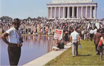  ??  ?? COURAGE: Writer James Baldwin, left, spoke out on race, justice and civil rights. Above, the 1963 March on Washington.