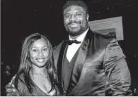  ??  ?? Alicia McDonald with her husband, Tampa Bay defensive end Clinton McDonald