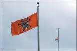  ?? CP FILE PHOTO ?? The Canadian flag hangs half-mast as a ceremonial flag is raised to honour victims of the residentia­l school system during the Xe xe Smun’ eem-Victoria Orange Shirt Day Every Child Matters ceremony at Centennial Square in Victoria, on Sept. 30, 2021.