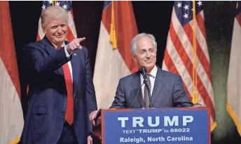  ?? SARA D. DAVIS, GETTY IMAGES ?? President Trump stands next to Sen. Bob Corker, R-Tenn., at a campaign event. Corker, a key foreign policy adviser to Trump, says that he sometimes speaks to Trump through the media.