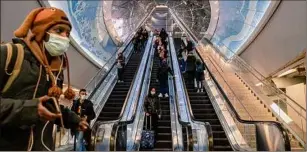  ?? David Dee Delgado / Getty Images ?? Travelers make their way through Penn Station in Manhattan. Amtrak will upgrade rail lines north of the station to improve access from the suburbs.