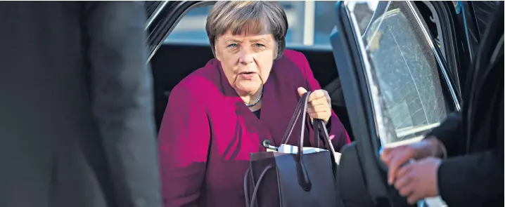  ??  ?? Angela Merkel, the German chancellor, arrives in Berlin for what was expected to be the final moments of coalition talks between her Christian Democratic bloc and the Social Democratic party led by Martin Schulz. But there were some surprises in store