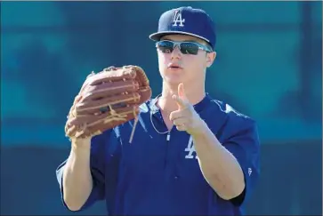  ?? Luis Sinco
Los Angeles Times ?? JOC PEDERSON works on his fielding skills while at the Dodgers spring training camp in March. He says of his father, Stu: “He taught me how to play the game the right way, it’s up to me now.”