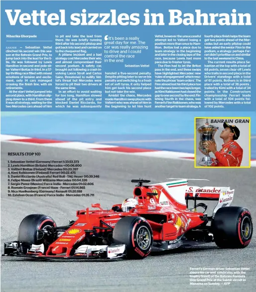  ?? — AFP ?? Ferrari’s German driver Sebastian Vettel steers his car and celebrates with the trophy (inset) at the Bahrain Formula One Grand Prix at the Sakhir circuit in Manama on Sunday.