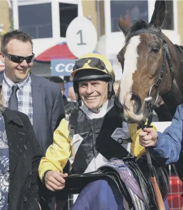  ?? ?? 0 Rob James and Win My Wings in the winners’ enclosure after victory in the Scottish Grand National