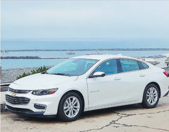  ?? PHOTOS: BRIAN HARPER ?? The redesigned 2016 Chevrolet Malibu Hybrid is a handsome, roomy family sedan that, in real world testing, sipped gas at a frugal 5.5 L/100 km.