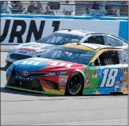  ?? AP/RICK SCUTERI ?? Kyle Busch (18) leads Brad Keselowski on lap 120 during Sunday’s NASCAR Cup Series race in Avondale, Ariz. Busch won for the eighth time this season, while Keselowski — already eliminated from the playoffs — finished second.