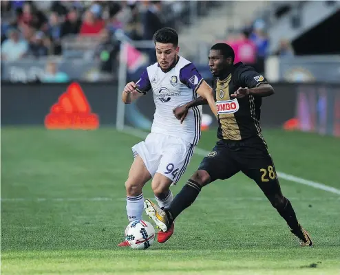  ?? — THE CANADIAN PRESS ?? Former Orlando defender Victor Giro, left, is the newest member of the Whitecaps. The Brazilian comes over from a Tigers team that collapsed last season after showing great promise to begin the campaign