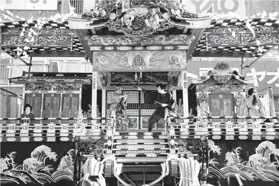  ?? Photos by Toru Hanai / Associated Press ?? Residents perform kabuki for the Chichibu Night Festival in Japan, which has its roots in an older tradition of villagers giving thanks to the nearby mountain god.