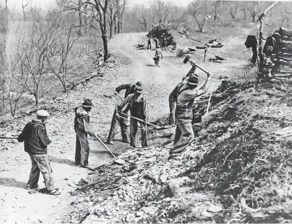  ?? AP ?? Works Progress Administra­tion workers build a road in March 1936, a year after Social Security was created to help supplement personal savings and a possible company pension for retirees.