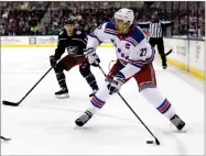  ?? AP PHOTO BY PAUL VERNON ?? In this 2017, file photo, New York Rangers defenseman Ryan Mcdonagh, right, looks to pass in front of Columbus Blue Jackets forward Matt Calvert during an NHL hockey game in Columbus, Ohio.