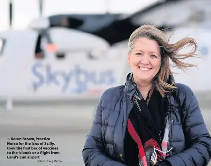  ?? Picture: : Greg Martin ?? > Karen Brown, Practice Nurse for the Isles of Scilly, took the first box of vaccines to the islands on a flight from Land’s End airport