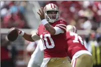  ?? JED JACOBSOHN — THE ASSOCIATED PRESS ?? San Francisco 49ers quarterbac­k Jimmy Garoppolo (10) looks to pass against the Las Vegas Raiders during the first half of an NFL preseason football game in Santa Clara Sunday.