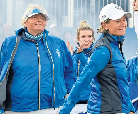  ??  ?? Team Europe captain Catriona Matthew leads Laura Davies and her winning side out for the presentati­on.