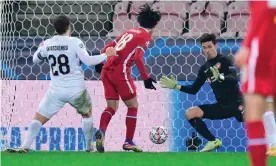  ?? Photograph: Bo Amstrup/Ritzau Scanpix/AFP/Getty Images ?? Takumi Minamino’s 89th-minute effort was ruled out in confusing circumstan­ces after the offside it was initially disallowed for proved incorrect.