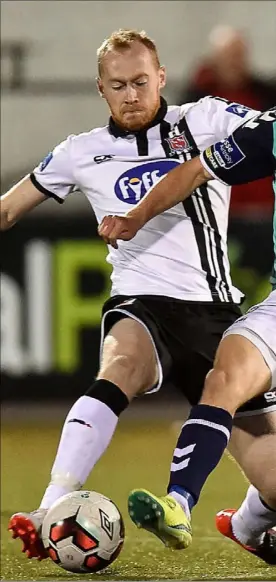  ??  ?? Chris Shields stretches out to dispossess Lukas Schubert of Derry City at Oriel Park on Friday night.