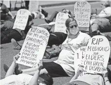  ?? JUSTIN SULLIVAN, GETTY IMAGES ?? Protesters stage a die-in in San Francisco last week.