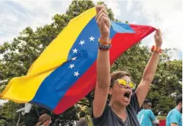  ?? AP PHOTO BY FERNANDO LLANO ?? Opponents of Venezuelan President Nicolas Maduro protest Monday the previous day’s presidenti­al election which Maduro won, in Caracas, Venezuela.