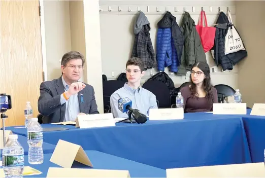  ?? KAITLIN WASHBURN/SUN-TIMES ?? U.S. Rep. Brad Schneider (far left) and 13 Jewish college students discuss how antisemiti­sm on college campuses has risen since the start of the Israel-Hamas war during a talk at the Jewish Community Center in Northbrook on Monday.