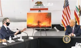  ?? Andrew Harnik / Associated Press ?? Gov. Gavin Newsom briefs President Trump on the extraordin­arily destructiv­e wildfires burning across the state. The president met with state officials at an airfield outside Sacramento.