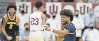  ?? TREVOR RUSZKOWSKI/ USA TODAY SPORTS ?? Guard Mike Smith celebrates a basket Saturday against Indiana, one of three wins last week for Michigan.