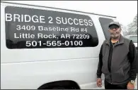  ?? (Arkansas Democrat-Gazette/Sean Clancy) ?? Ronald Wilkerson stands next to the Bridge 2 Success van. Between 40-60 students attend after-school activities at Bridge 2 Success. They are also taken on trips around the state and to Memphis.