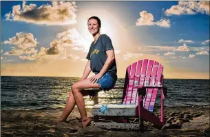  ?? PHOTOS BY RICHARD GRAULICH / THE PALM BEACH POST ?? Grace Carpenter sits in Juno Beach on a chair she decorated with artist Jordan Clemmons for the breast cancer awareness month “Pink Chair Project.” The chairs and the stories of survivors are placed around Jupiter and Palm Beach Gardens.
